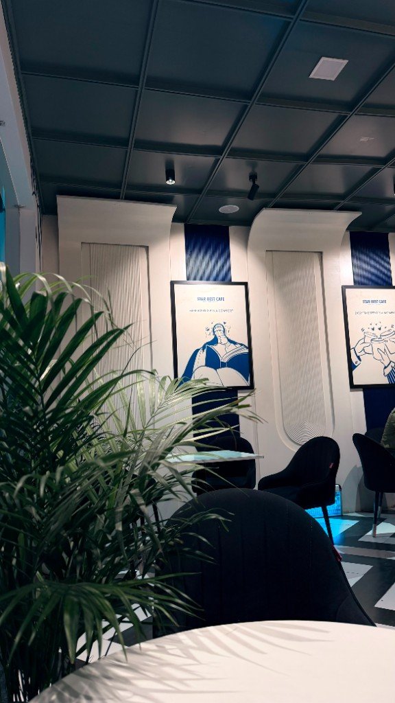 Lounge seating with Star Best Cafe wall art